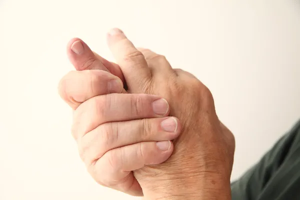 Man has pain in pinky finger Stock Image
