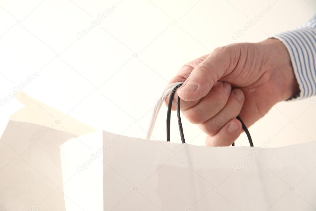 Man holds shopping bags