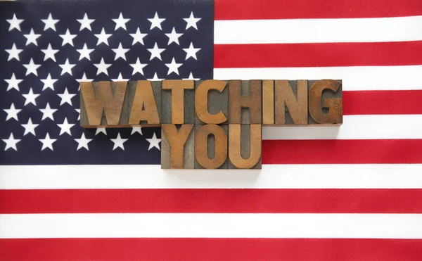 Watching you in wood type on flag — Stock Photo, Image