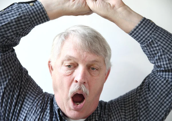 Yawning senior man — Stock Photo, Image