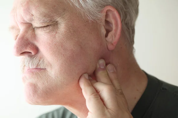 Older man with painful jaw — Stock Photo, Image