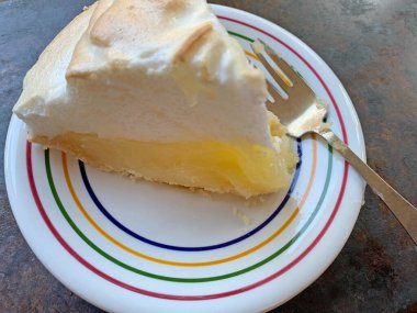 A slice of pie on a colorful dish