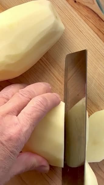 Peeled Russet Potatoes Being Cut — Stock Video