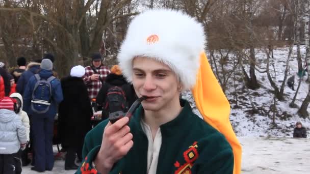 Young ukrainian cossack with tobacco pipe — Stock Video