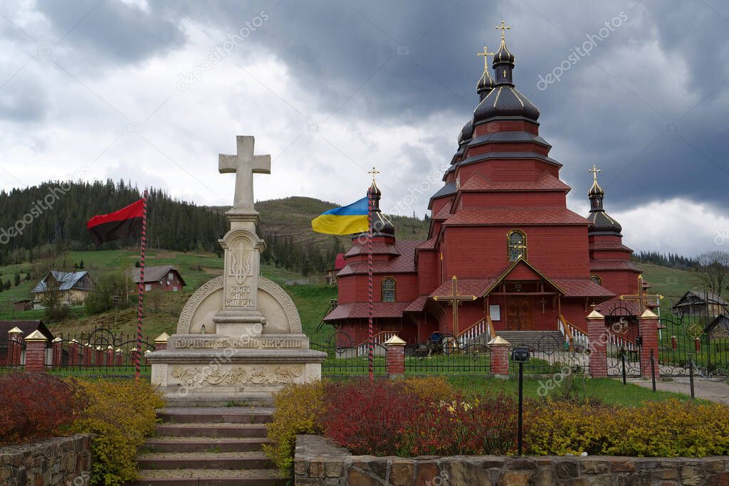 Red church in The Volosianka village in Carpathian Mountains, Ukraine