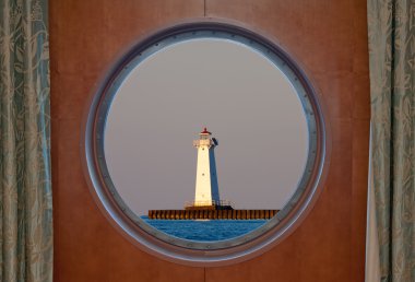 Sodus Bay Lighthouse Seen Through a Porthole clipart