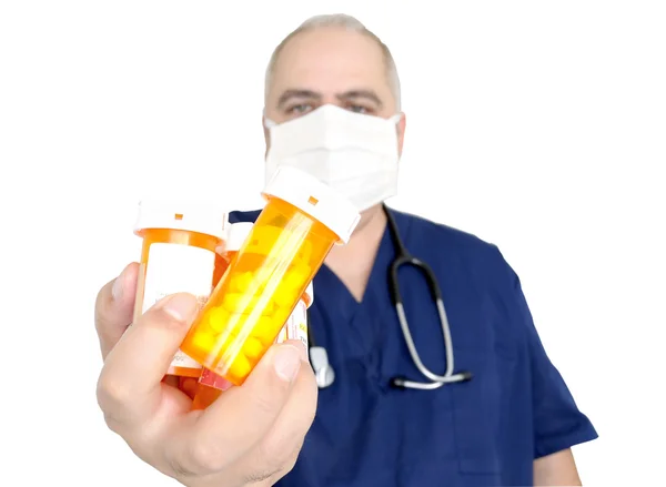 Doctor holding pill bottles — Stock Photo, Image