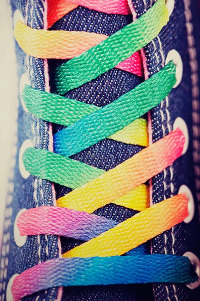 Closeup of a sneaker with colored shoelaces — Stock Photo, Image