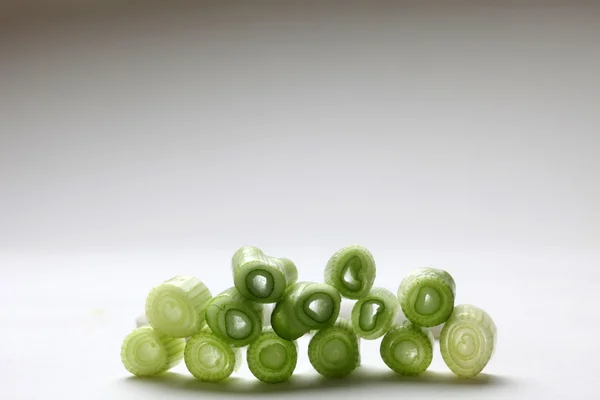 Slices of young onion — Stock Photo, Image