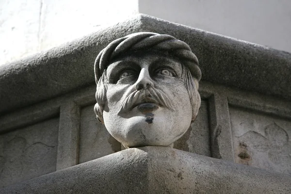 Head, Antique bas-relief architectural detail of the St. James Cathedral — Stock Photo, Image