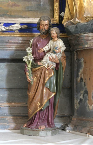 Saint joseph bedrijf baby jesus — Stockfoto