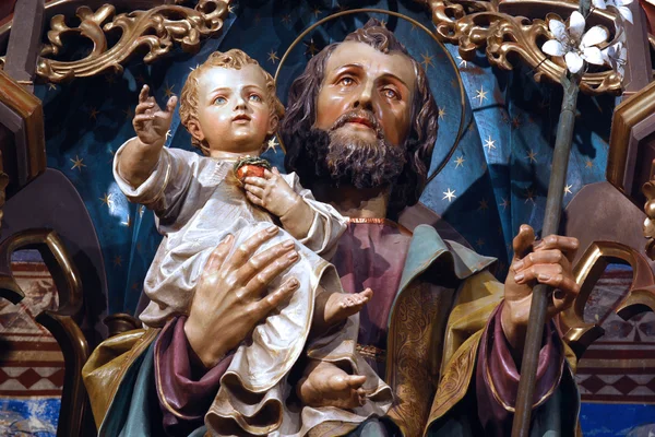 Saint joseph anläggning jesus barnet — Stockfoto