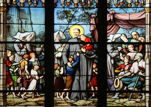 Saint Vincent de Paul kokoontuu hyväntekeväisyyden tyttärien kanssa hylättyjä lapsia — kuvapankkivalokuva