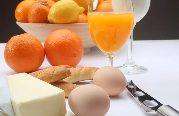 Breakfast with juice, milk, fruits and eggs — Stock Photo, Image