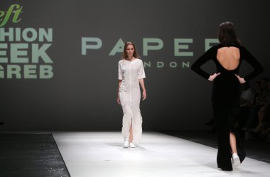 Fashion model wearing clothes designed by Paper London on the Zagreb Fashion Week on May 09, 2014 in Zagreb, Croatia clipart