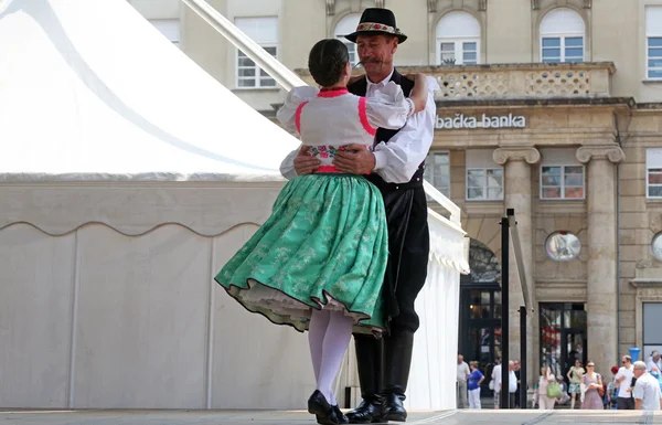 Members of folk groups Nograd from Salgotarjan, Hungary during the 48th International Folklore Festival in center of Zagreb, Croatia on July 19, 2014 — Stock Photo, Image