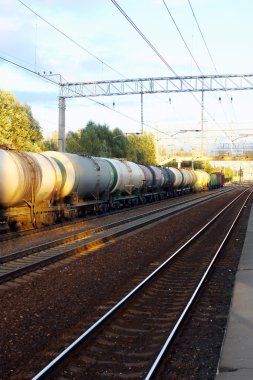 Tanks with fuel by rail clipart