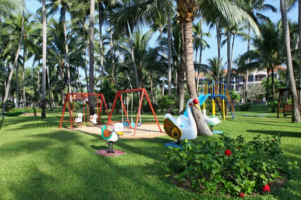 Children's playground at tropical park — Stock Photo, Image