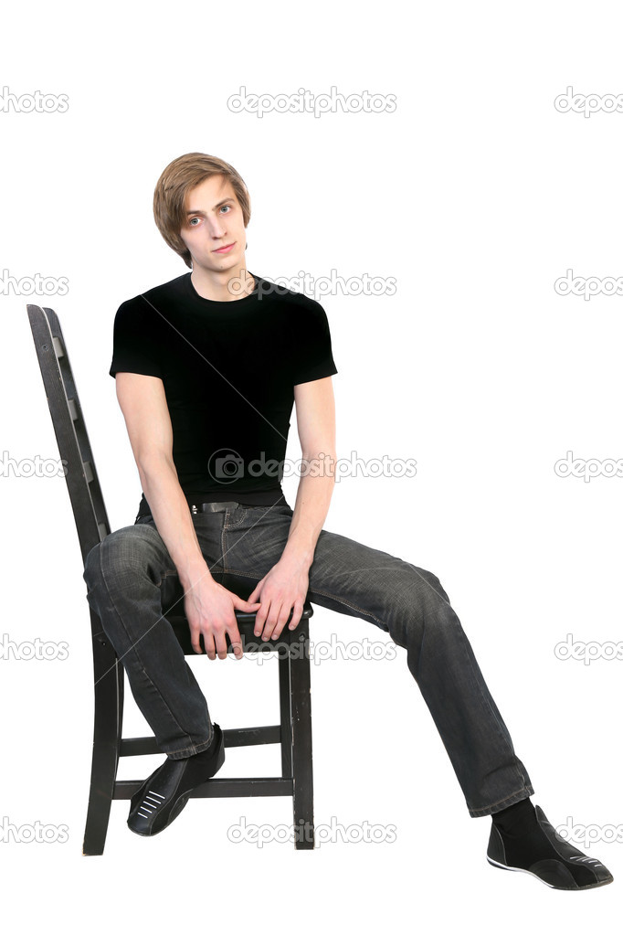 Handsome young man sitting on a chair