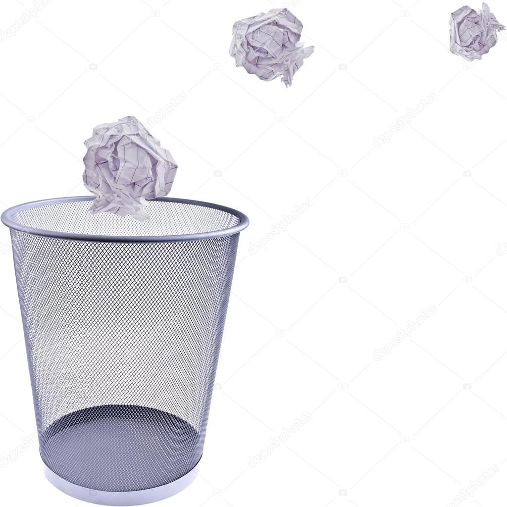 Tossing Paper into a wastebasket, completely isolated on whit — Stock Photo © Dphiman 49783865