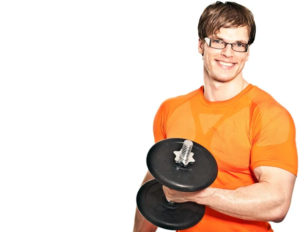Smiling young man raising dumbbell - isolated on white and space — Stock Photo, Image
