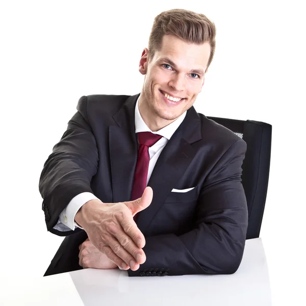 Freundlicher Geschäftsmann gibt die Hand für einen Handschlag, um die agr zu besiegeln — Stockfoto