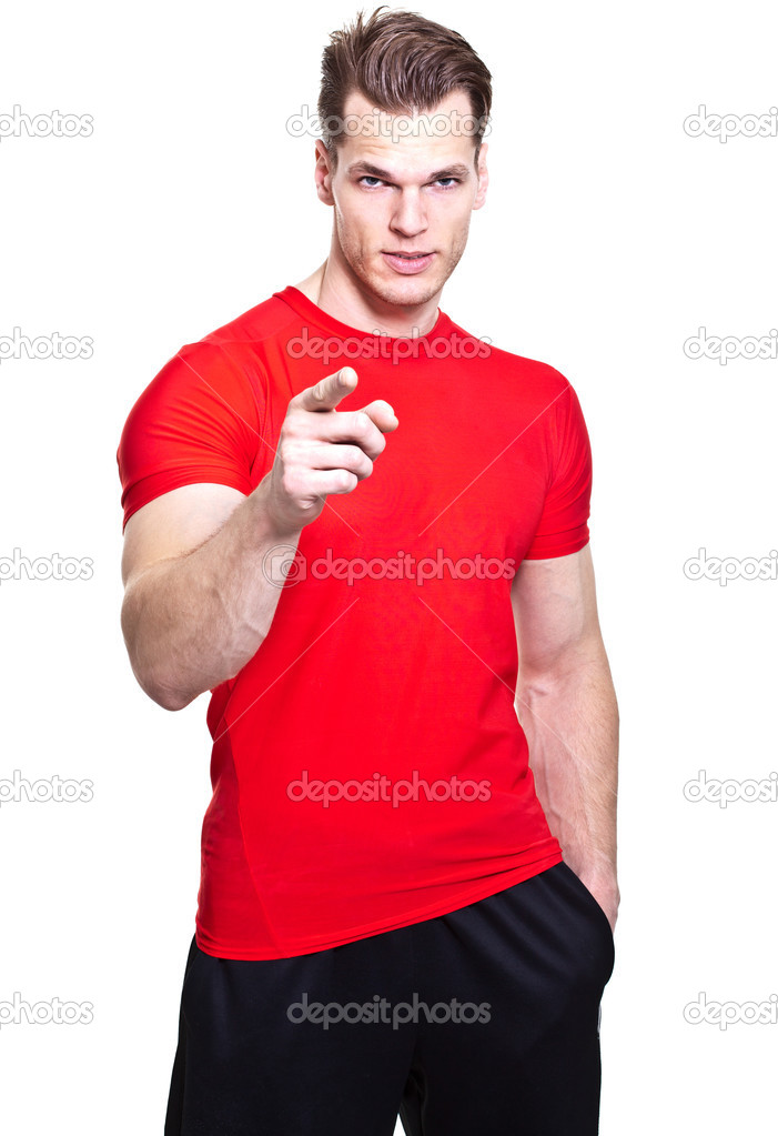 Personal trainer pointing at viewer, isolated in whit