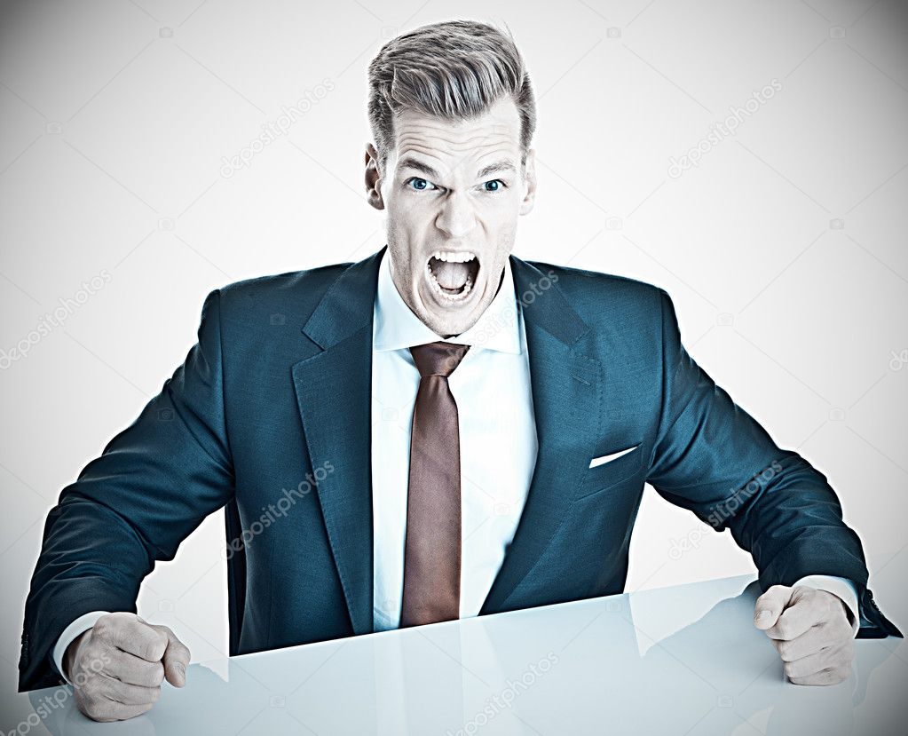 Anger management - young businessman expressing negativit