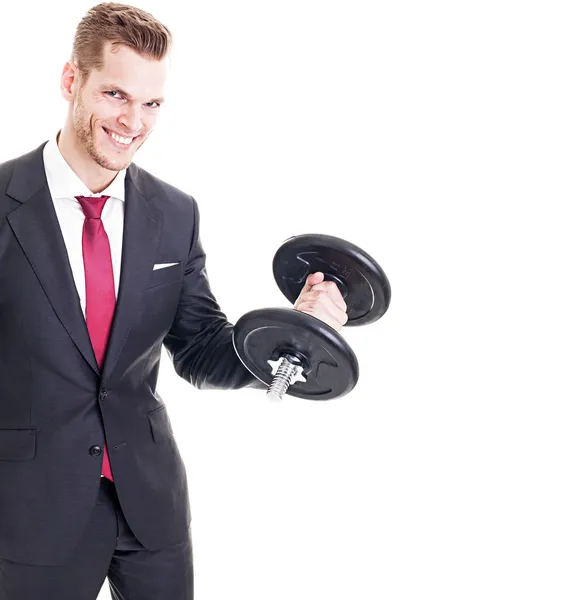 Empresário bem sucedido flexionando músculos ao levantar um haltere — Fotografia de Stock