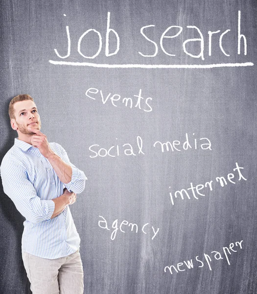 Young man looking for jobs — Stock Photo, Image