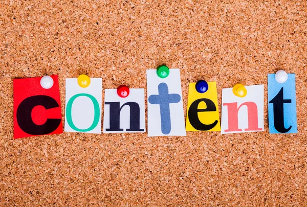 The word content in cut out magazine letters pinned to a cork no — Stock Photo, Image