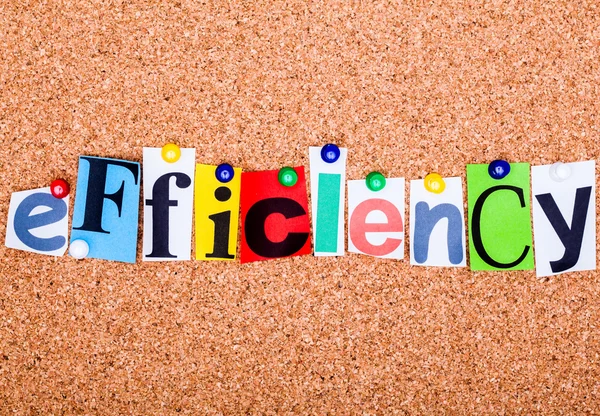 The word efficiency in cut out magazine letters pinned to a cork — Stock Photo, Image