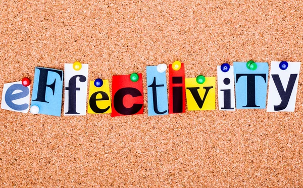 The word effectivity in cut out magazine letters pinned to a cor — Stock Photo, Image