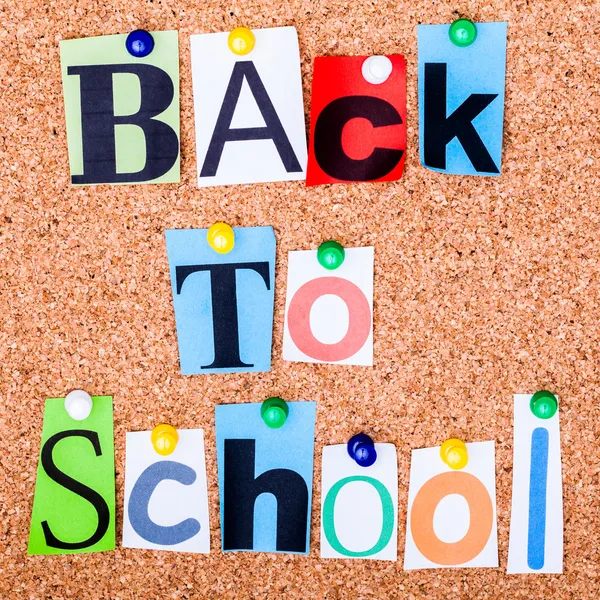 The phrase Back to School in cut out magazine letters pinned to — Stock Photo, Image