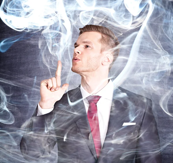 Empresário com finge de arma fumante — Fotografia de Stock