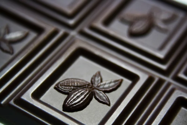 Chocolate bar with embossed cocoa beans — Stock Photo, Image