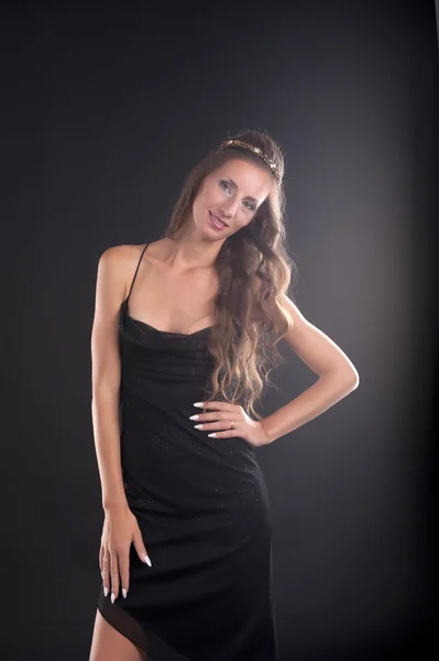 A young woman in a black dress — Stock Photo, Image