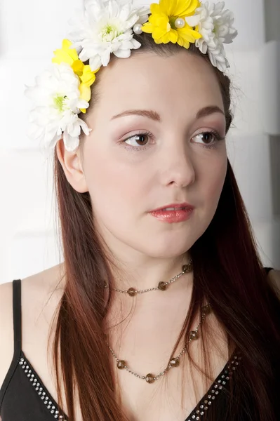 Girl with a wreath of flowers — Stock Photo, Image