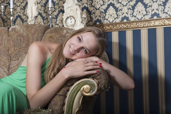 Portrait of blonde in green dress — Stock Photo, Image