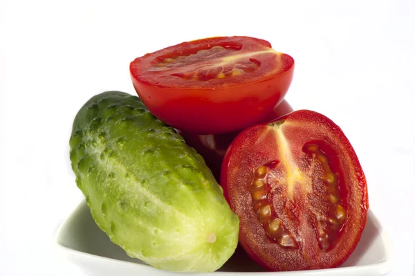 Ripe red tomatoes and cucumber — Stock Photo, Image