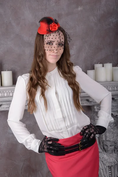 Young woman in a red hat with a veil — Stock Photo, Image