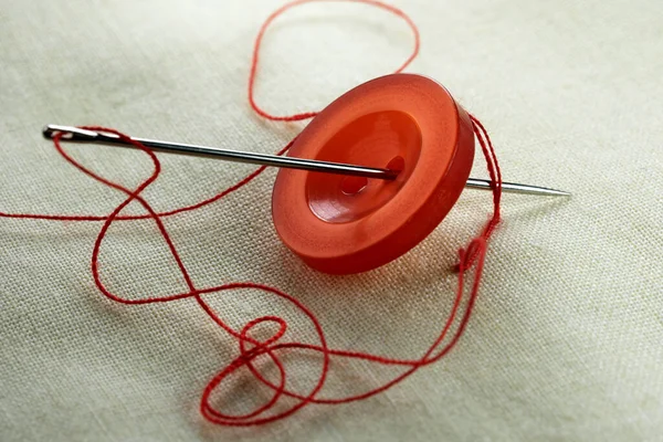 Red Button Needle Inserted Thread White Linen Cloth Close Macro — Stock Photo, Image
