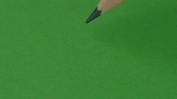 Simple Pencil Draws Cross Green Paper Video Clip Close — Stock Video