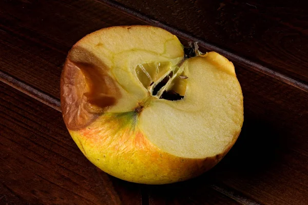 Half Spoiled Shriveled Rotting Apple Dark Wooden Background Close — Stock Photo, Image