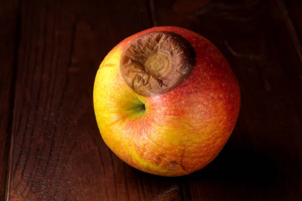 Spoiled Shriveled Rotten Apple Dark Wooden Background Close — Stock Photo, Image