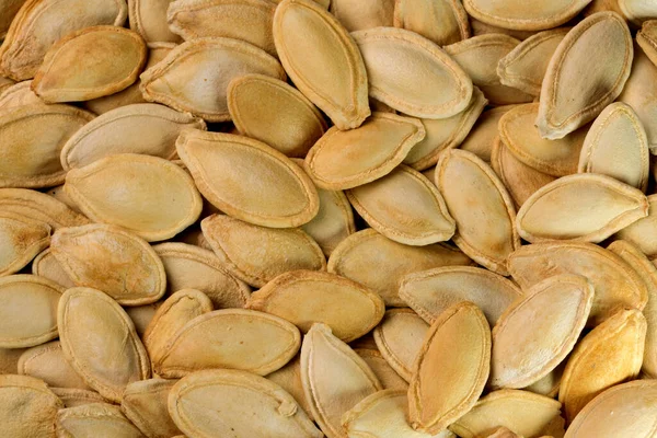 Roasted Unpeeled Pumpkin Seeds Background Vertical View Full Screen Closeup — стоковое фото