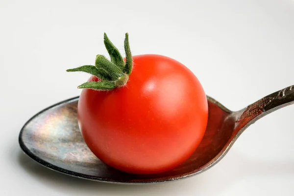 Small Red Ripe Tomato Teaspoon White Mirror Background Close — Stockfoto