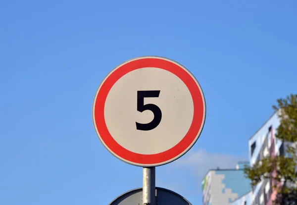 Road sign Maximum speed limit 5 km/h and blue sky.