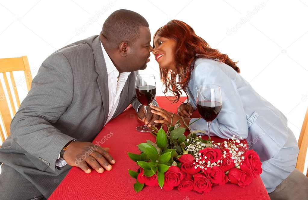 African American Couple About to Kiss in Romantic Dinner