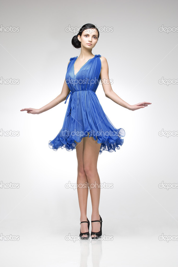 brunette in blue dress